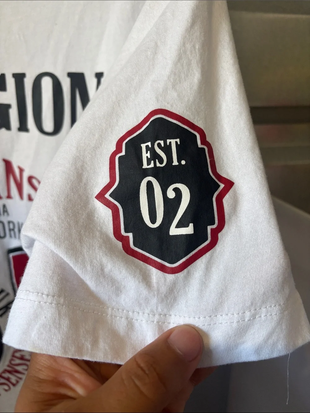 True Religion White T‑Shirt with Black Logo and Red Sleeve Patch
